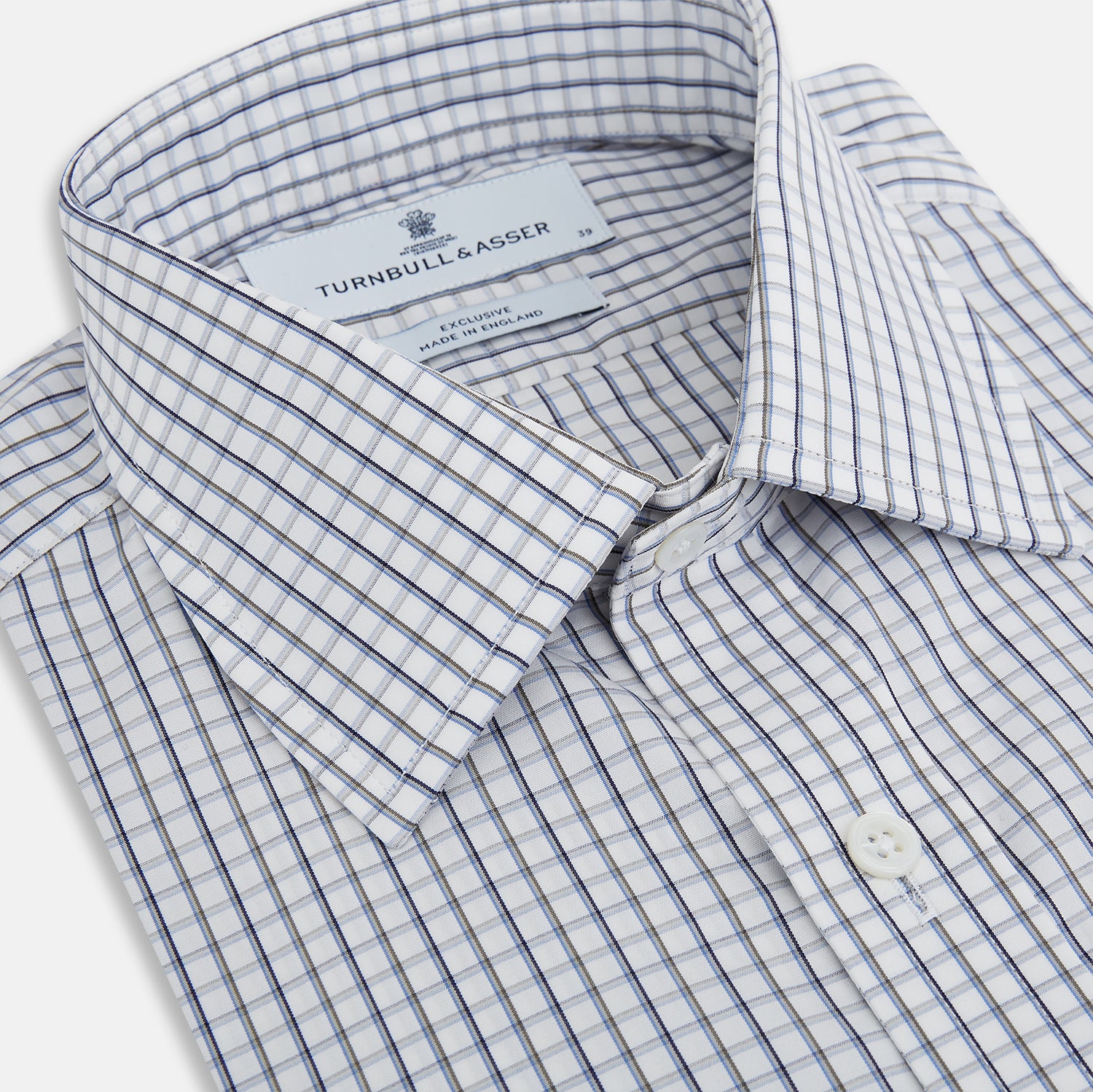 View 2 of product The Turnbull & Asser Blue and Coffee Tattersall Check Mayfair Shirt is a long-sleeved, button-up style made from Italian cotton, featuring a collar and buttoned cuffs, shown laid flat against a white background.