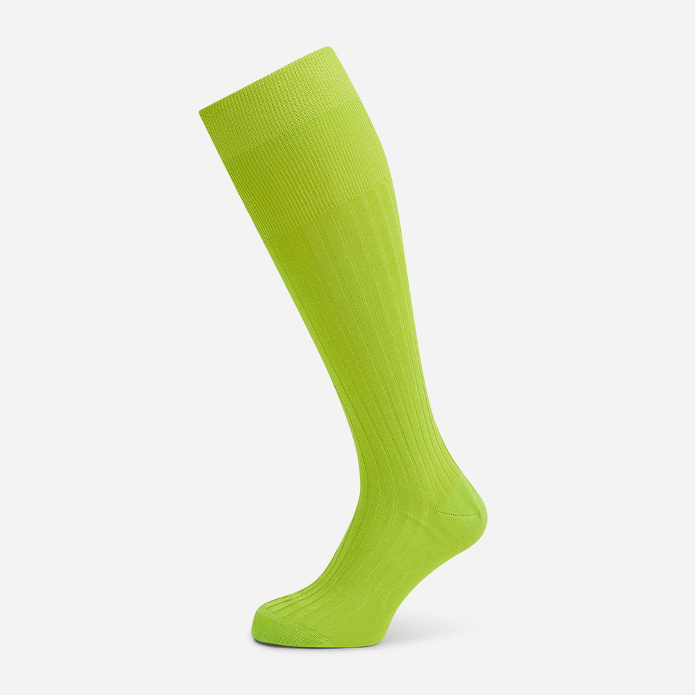 The Turnbull & Asser Lime Long Sock is a single bright green, knee-high sock with a ribbed texture, crafted from soft mercerised cotton, shown against a white background.
