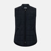View 1 of product The Turnbull & Asser Navy Quilted Gilet is sleeveless and lightweight, with a front zipper, zippered side pockets, chest pocket, and rounded hem—ideal for versatile layering. Shown on a plain white background.