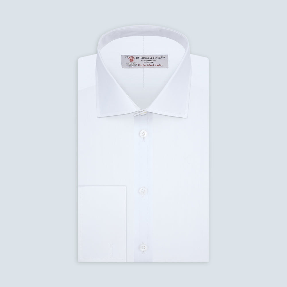A White Self-On-Self Herringbone Sea Island Quality Cotton Shirt with Regent collar and double cuffs by Turnbull & Asser, displayed against a light gray background.