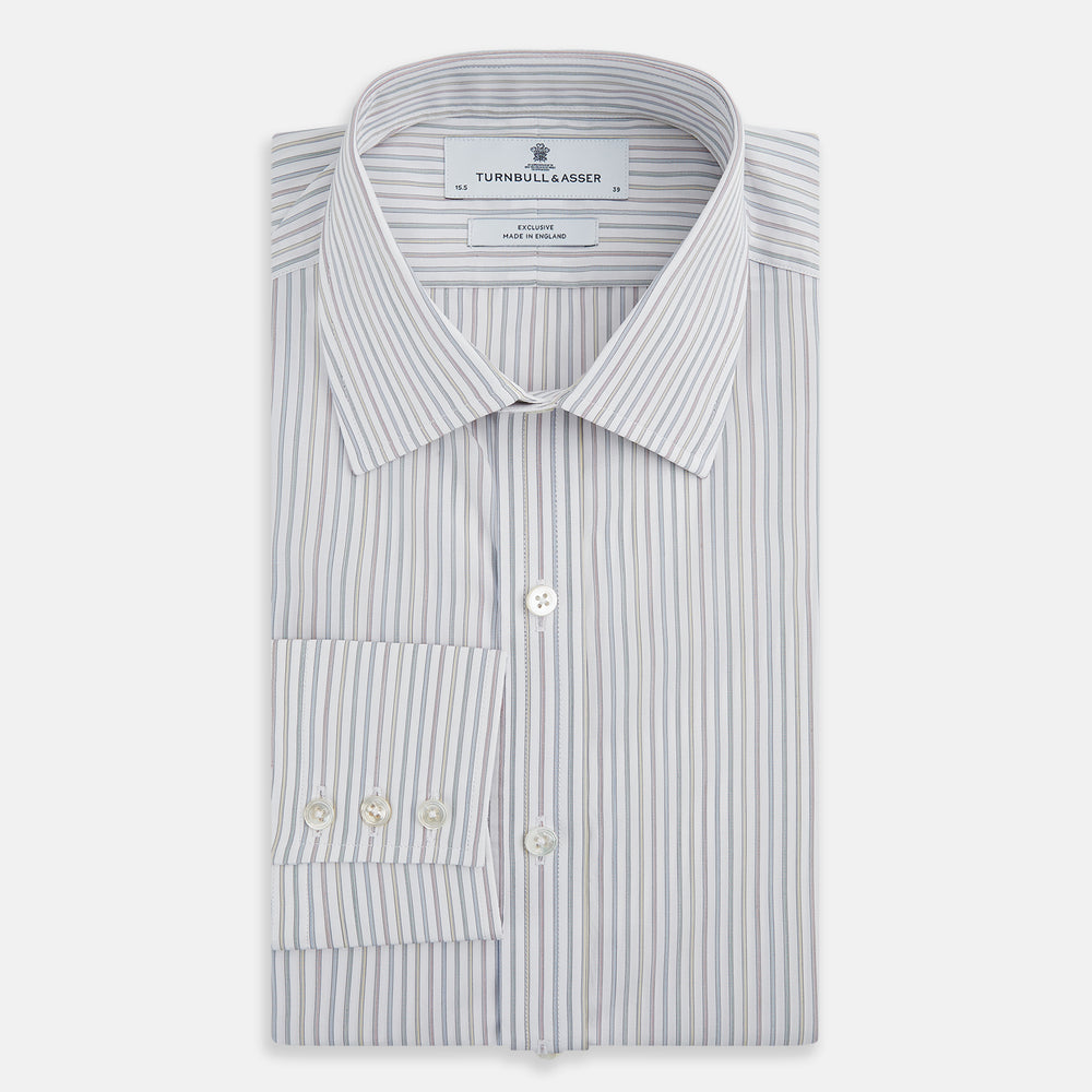 The Turnbull & Asser Multicoloured Music Stripe Mayfair Shirt features thin blue and white vertical stripes, a classic T&A collar, and buttoned cuffs, shown laid flat on a white background.