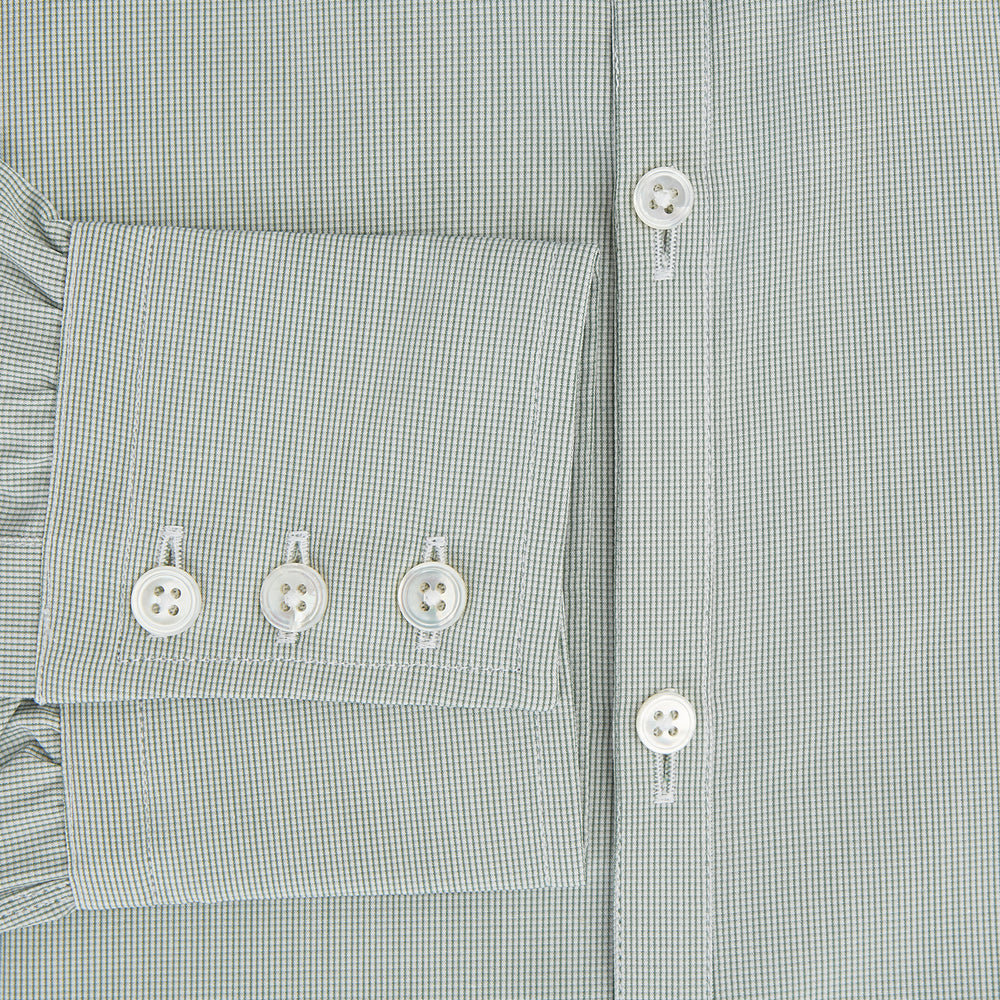 A dark green micro graph check Westminster shirt by Turnbull & Asser, featuring fine British craftsmanship, a Turnbull collar, and white buttons, is laid flat on a white background.