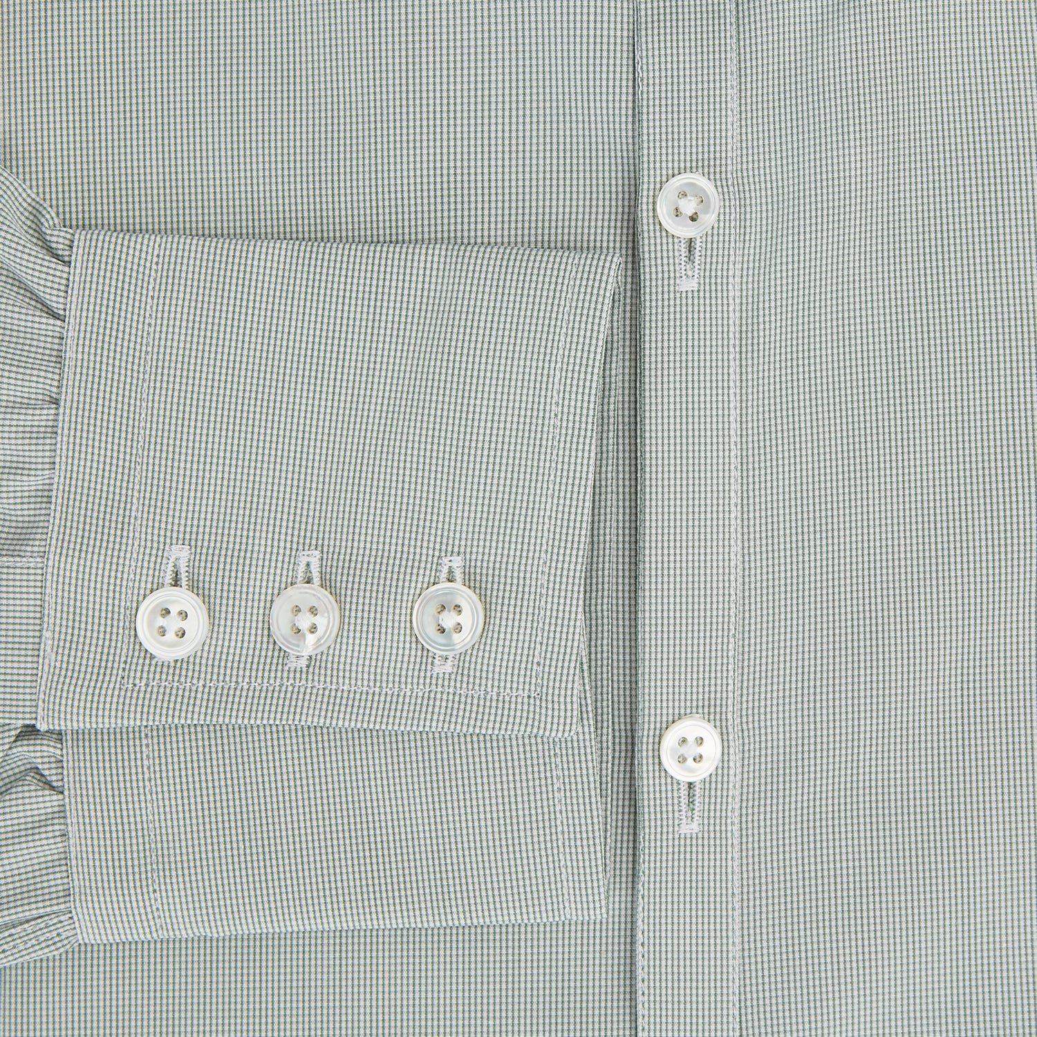 View 4 of product A dark green micro graph check Westminster shirt by Turnbull & Asser, featuring fine British craftsmanship, a Turnbull collar, and white buttons, is laid flat on a white background.