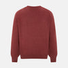 View 3 of product The Turnbull & Asser Burgundy Crew V-Neck Cashmere Jumper is a long-sleeve knitwear piece with ribbed cuffs, hem, and neckline, shown on a white background.