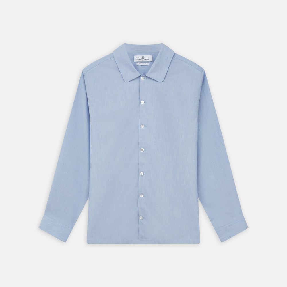 The Turnbull & Asser Slate Blue Chambray Holiday Fit Fellows Shirt features long sleeves and a classic collar, laid flat on a white background—a versatile summer piece for any occasion.