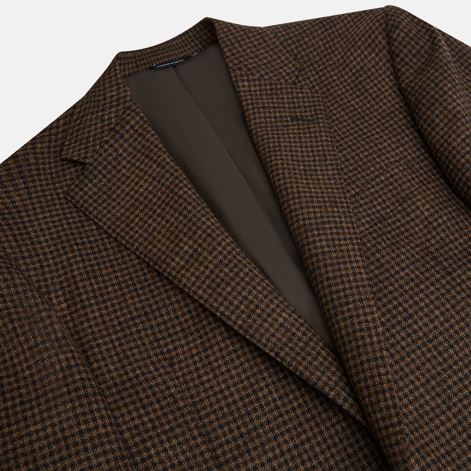 View 2 of product The Turnbull & Asser Brown Gingham Check Sports Jacket features a single button closure, notched lapels, and two front flap pockets, shown against a plain white background.