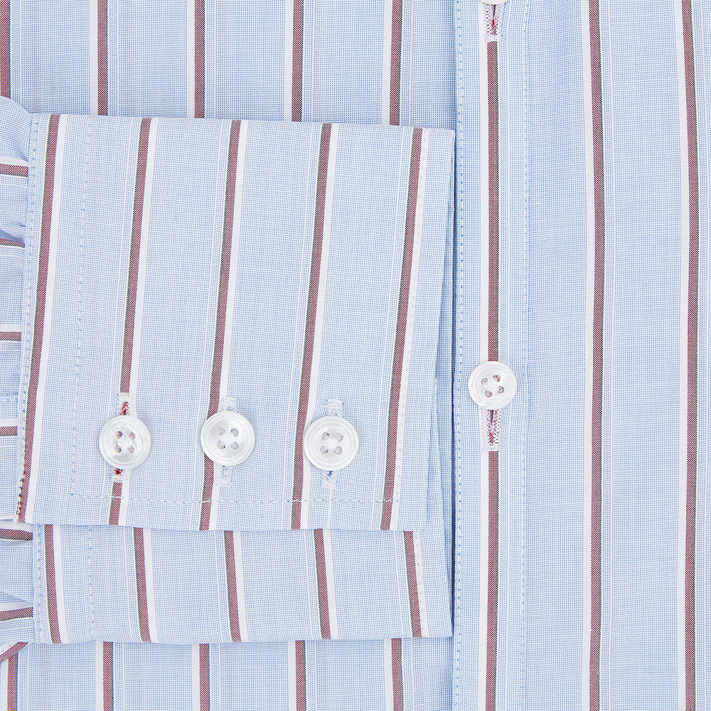 The Turnbull & Asser Blue and Burgundy Multi-Stripe Westminster Shirt features a pointed collar and long sleeves, laid flat on a white background to highlight its fine British craftsmanship.
