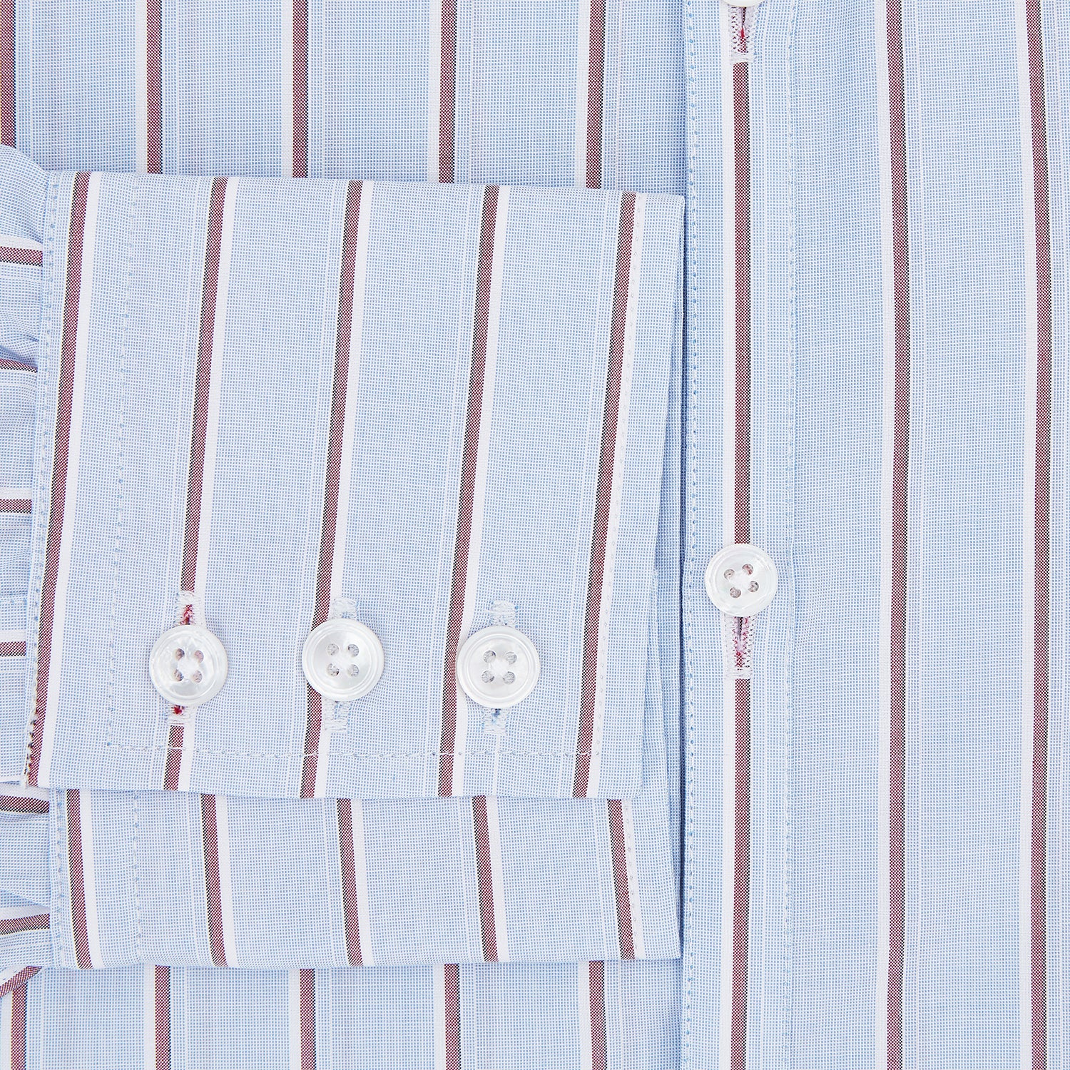 View 4 of product The Turnbull & Asser Blue and Burgundy Multi-Stripe Westminster Shirt features a pointed collar and long sleeves, laid flat on a white background to highlight its fine British craftsmanship.