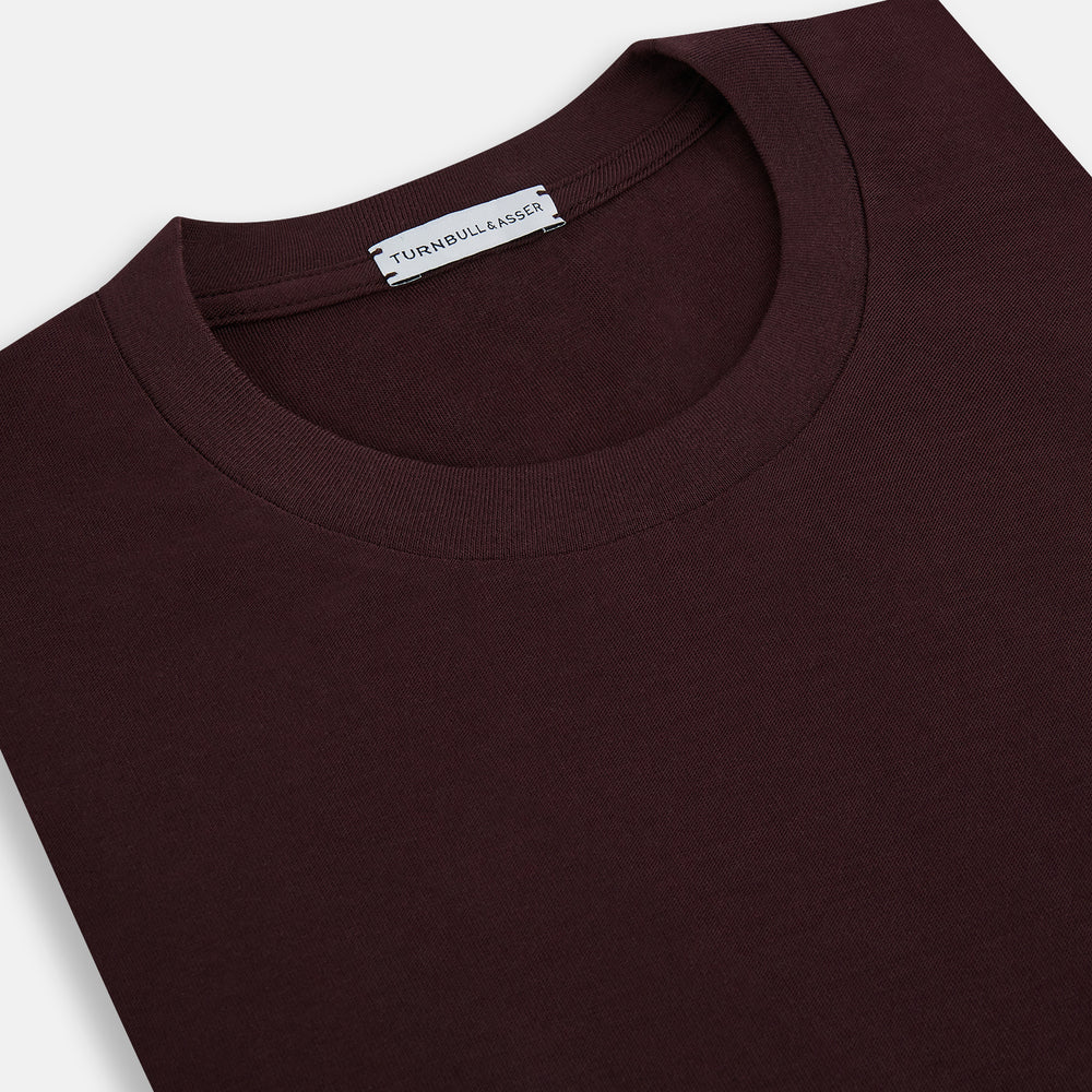 The Turnbull & Asser Burgundy Short-Sleeve T-shirt, featuring a crew neckline and clean design with no visible logos, is shown against a white background for a timeless and versatile look.