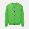 View 1 of product The Turnbull & Asser Lime Green Fine Merino V-Neck Cardigan features long sleeves and dark brown front buttons, shown against a plain white background.