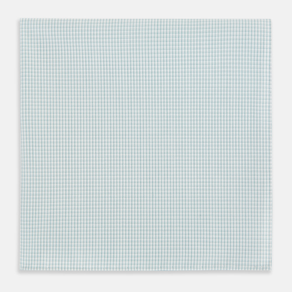 The Turnbull & Asser Sage Green Shadow Grid Check Hand-Rolled Handkerchief features a grid of small squares and hand-rolled edges, shown neatly folded on a white background.