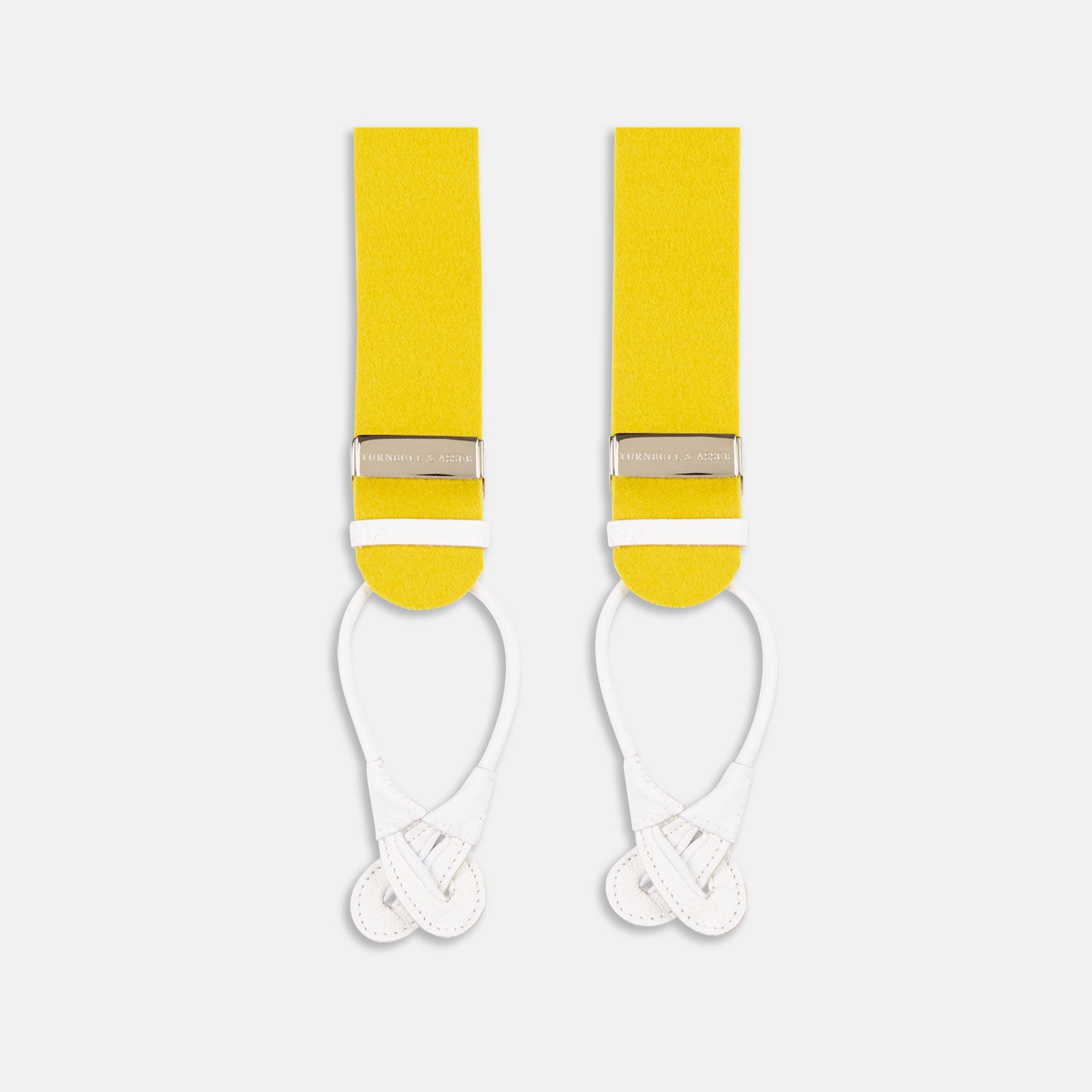 View 1 of product Turnbull & Asser's Golden Adjustable Felt Braces: two bright yellow fabric straps with silver clips and white leather loops, arranged vertically on a plain white background.