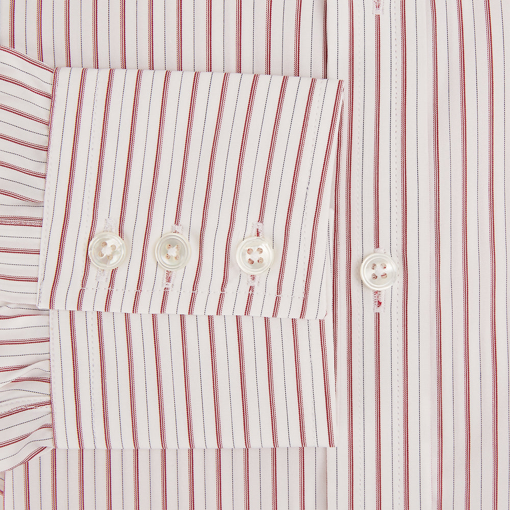 The Red Multi Ticking Stripe Mayfair Shirt by Turnbull & Asser features thin red and blue vertical stripes on white, a T&A collar, long sleeves, and button-up design.