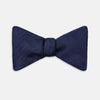 View 1 of product The Turnbull & Asser HERRINGBONE NAVY BOW TIE features a subtle herringbone pattern in navy blue, shown against a plain white background—the perfect accessory to elevate any smart look.