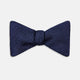 The Turnbull & Asser HERRINGBONE NAVY BOW TIE features a subtle herringbone pattern in navy blue, shown against a plain white background—the perfect accessory to elevate any smart look.