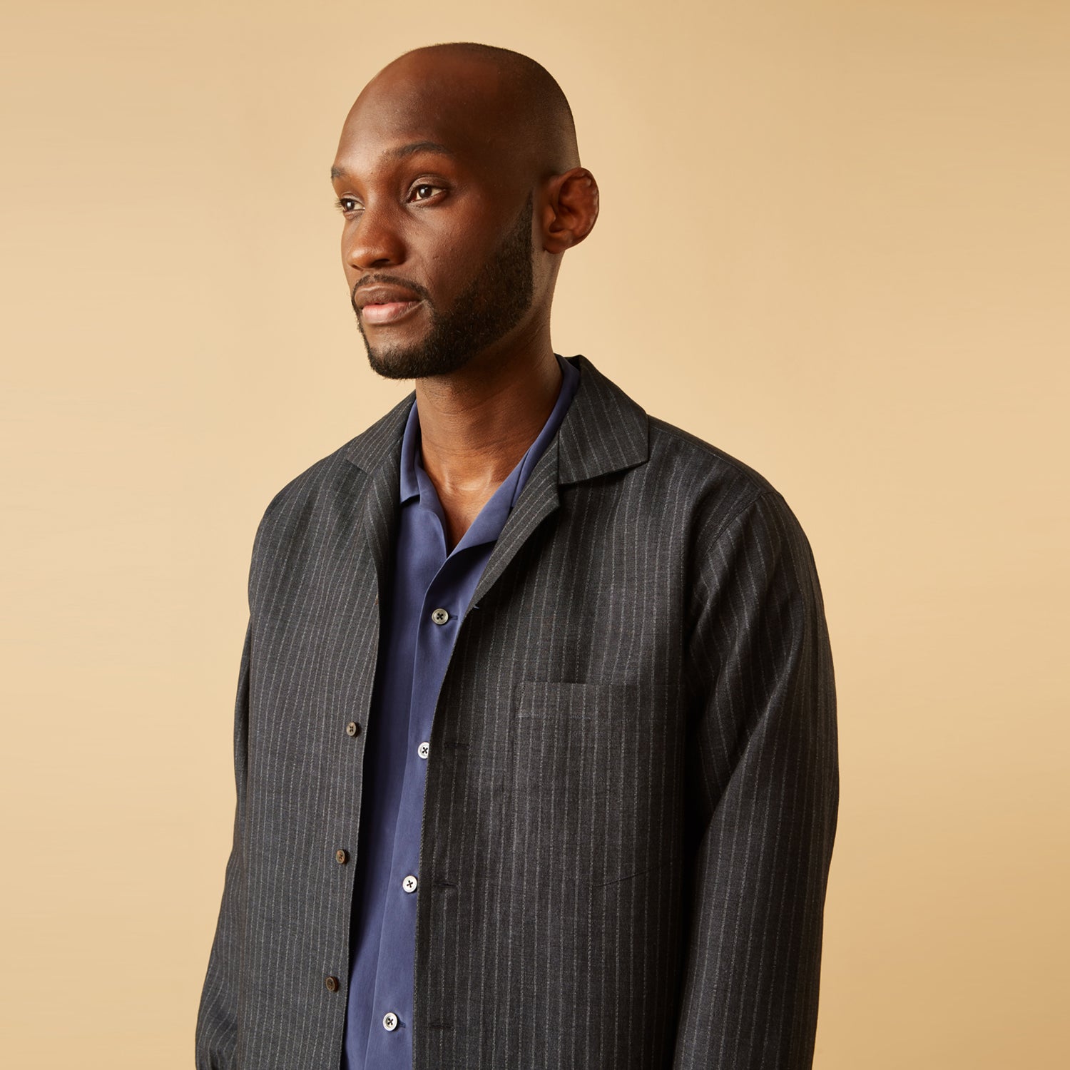 View 3 of product The Navy Tailored Pinstriped Shirt Jacket by Turnbull & Asser is a smart-casual, lightweight cotton-linen piece with long sleeves, a collar, left chest pocket, and front buttons for easy style.