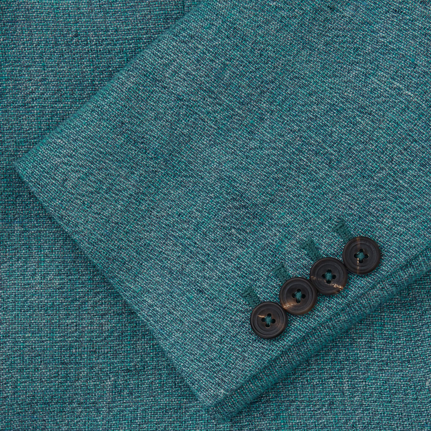 View 3 of product A man with short brown hair and a neutral expression stands against a plain background, wearing a Teal Linen Barrington Blazer by Turnbull & Asser, a light pink dress shirt, white trousers, brown loafers, and a patterned pocket square.