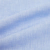 View 6 of product The Turnbull & Asser Pale Blue Linen Mayfair Shirt features a collar, front pocket, and white buttons. This long-sleeve shirt is displayed on a white background.
