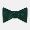 View 1 of product The Turnbull & Asser Turquoise and Forest Green Micro Dot Silk Bow Tie features small light green spots on a dark background, offering a stylish accessory for any occasion.