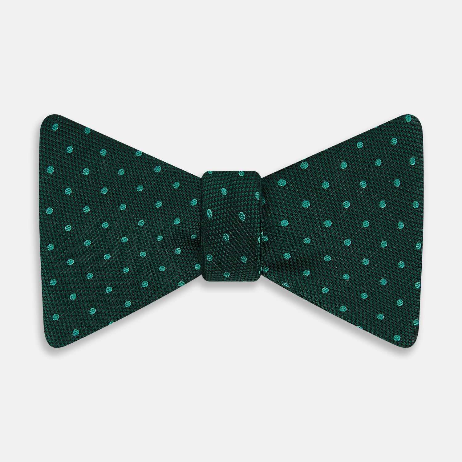 View 1 of product The Turnbull & Asser Turquoise and Forest Green Micro Dot Silk Bow Tie features small light green spots on a dark background, offering a stylish accessory for any occasion.