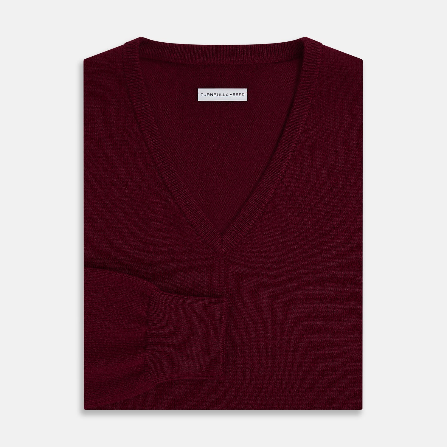 View 4 of product The Turnbull & Asser Burgundy Cashmere V-neck Jumper is shown on a white background.