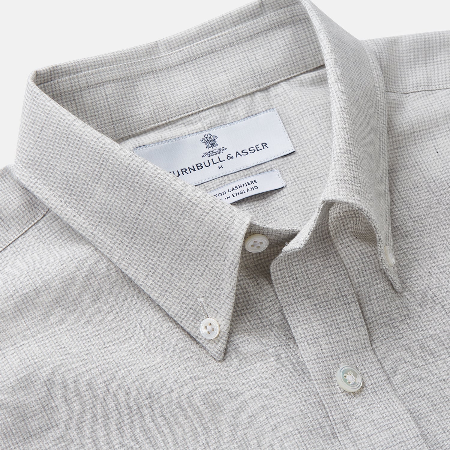 View 3 of product A Grey Fine Check Cotton Blend Weekend Fit Suffolk Shirt by Turnbull & Asser with long sleeves, a collar, and single chest pocket is laid flat on a white background.