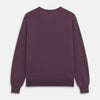 View 3 of product The Turnbull & Asser Plum Kennedy Merino V-Neck Jumper is a long-sleeved knitwear piece made from soft Italian wool, shown laid flat on a white background.