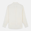 View 5 of product The Turnbull & Asser Cream Silk Weekend Fit Fairlight Shirt is a classic, soft-touch long-sleeve shirt with a collar, button-down front, and buttoned cuffs, shown laid flat on a plain white background.
