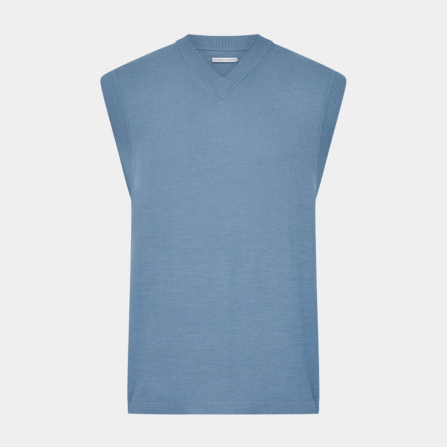 View 1 of product The Turnbull & Asser Pale Blue Fine Merino V-Neck Vest features a sleeveless design, knit texture, and classic V-neckline, shown against a plain white background.