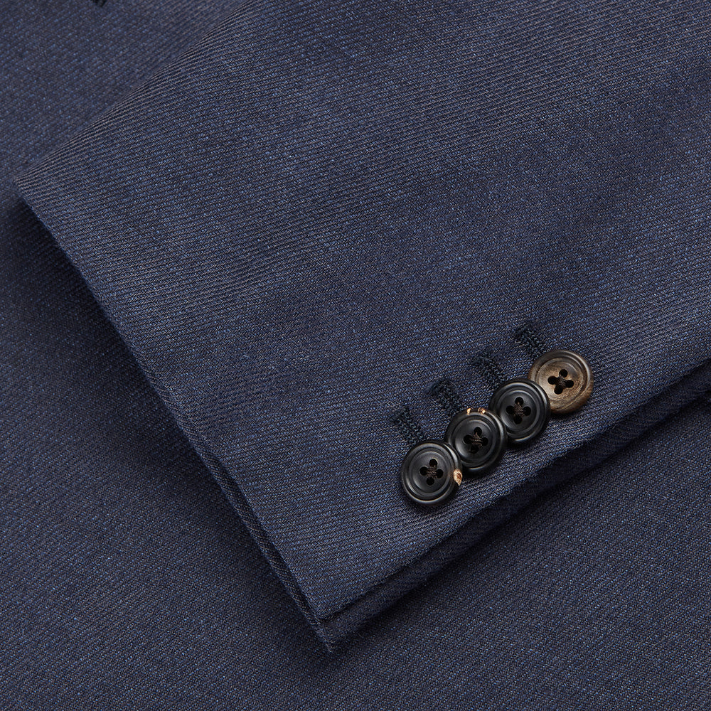 The Turnbull & Asser Navy Wool Blend Barrington Blazer features a notched lapel, single-button closure, three front pockets, and sleeve button accents, shown against a plain white background.
