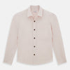 View 1 of product The Turnbull & Asser Pale Pink Hyde Overshirt is a long-sleeve, sanforised cotton button-up with a left chest pocket and dark buttons, shown laid flat on a white background.