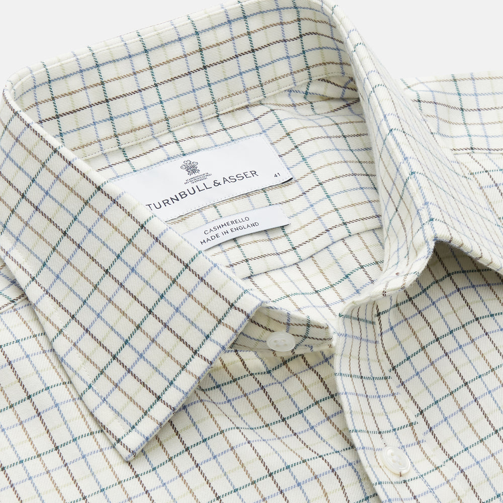 A Turnbull & Asser Green Tattersall Check Cashmerello Regular Fit Mayfair Shirt, featuring a long-sleeve button-up style with a green checkered pattern, is displayed on a plain white surface.