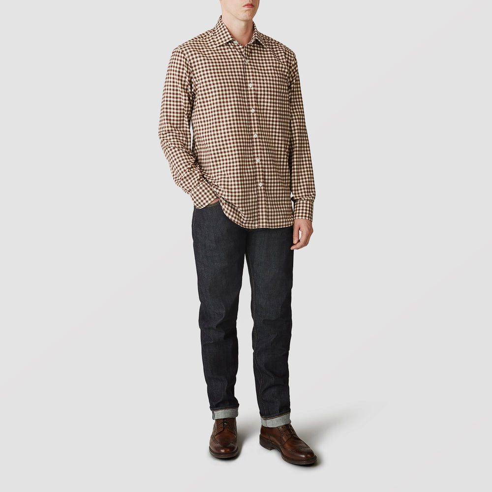 The Turnbull & Asser Brown Check Weekend Fit Shirt features a Derby collar, 1-button cuffs, and a brown check pattern—ideal for winter layering. Shown against a plain white background.