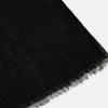 View 2 of product The Turnbull & Asser Charcoal Melange Cashmere Scarf features a smooth texture, subtle frayed edges, and a loosely knotted style, elegantly displayed on a white background—an ideal luxury accessory for any season.