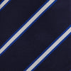 View 3 of product The White and Navy Blazer Silk Tie by Turnbull & Asser features diagonal white and light blue stripes on navy silk, shown rolled on a white background. A refined choice to complement any office shirt.