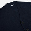 View 2 of product The Navy Melange Cashmere Cardigan by Turnbull & Asser features long sleeves, a V-neck, five dark buttons, ribbed cuffs and hem, and two front pockets. Shown against a plain white background.