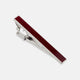 The Turnbull & Asser Burgundy Patterned Tie Bar features a rectangular sterling silver design with a burgundy inlay, ideal for formal attire, shown on a plain white background.