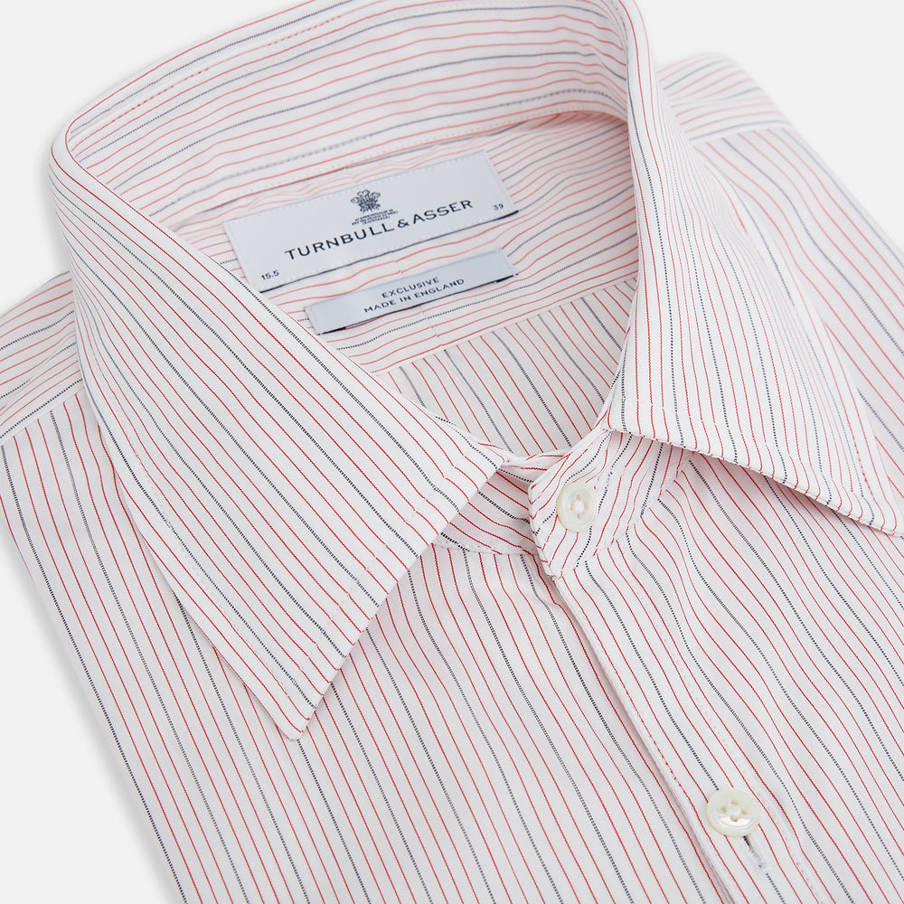 The Red Hairline Stripe Westminster Shirt by Turnbull & Asser features a pointed collar and thin vertical stripes in a light hue, displayed flat against a white background—a fine example of British craftsmanship.