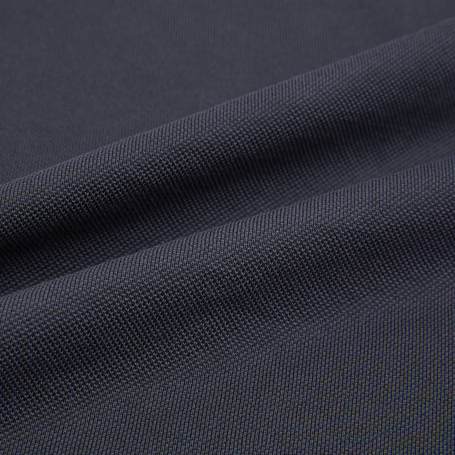 View 5 of product The Turnbull & Asser Charcoal Polo Shirt is a short-sleeve, soft cotton jersey top with a collar, three-button placket, and a left chest pocket, shown on a plain white background.