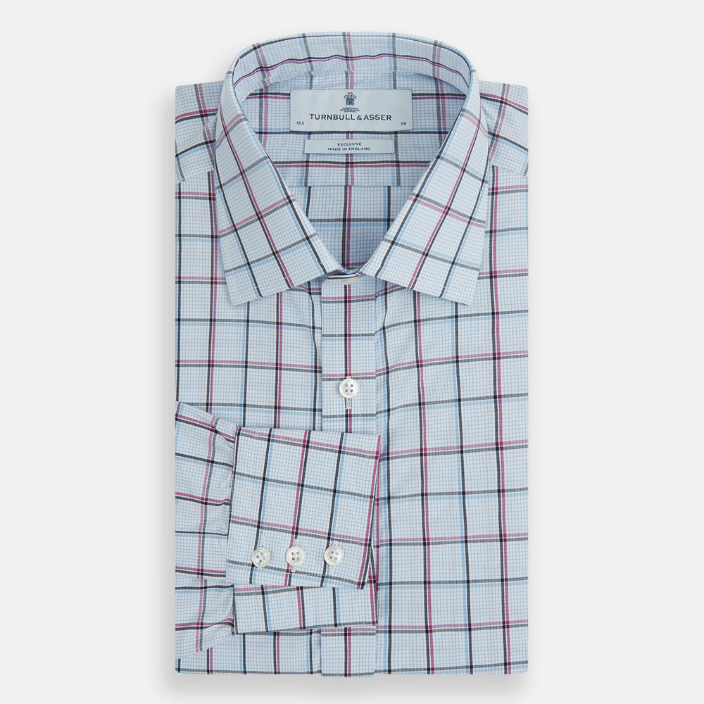 The Turnbull & Asser Blue and Pink Tattersall Check Mayfair Shirt features a classic tattersall pattern with a T&A collar and cuffed sleeves.