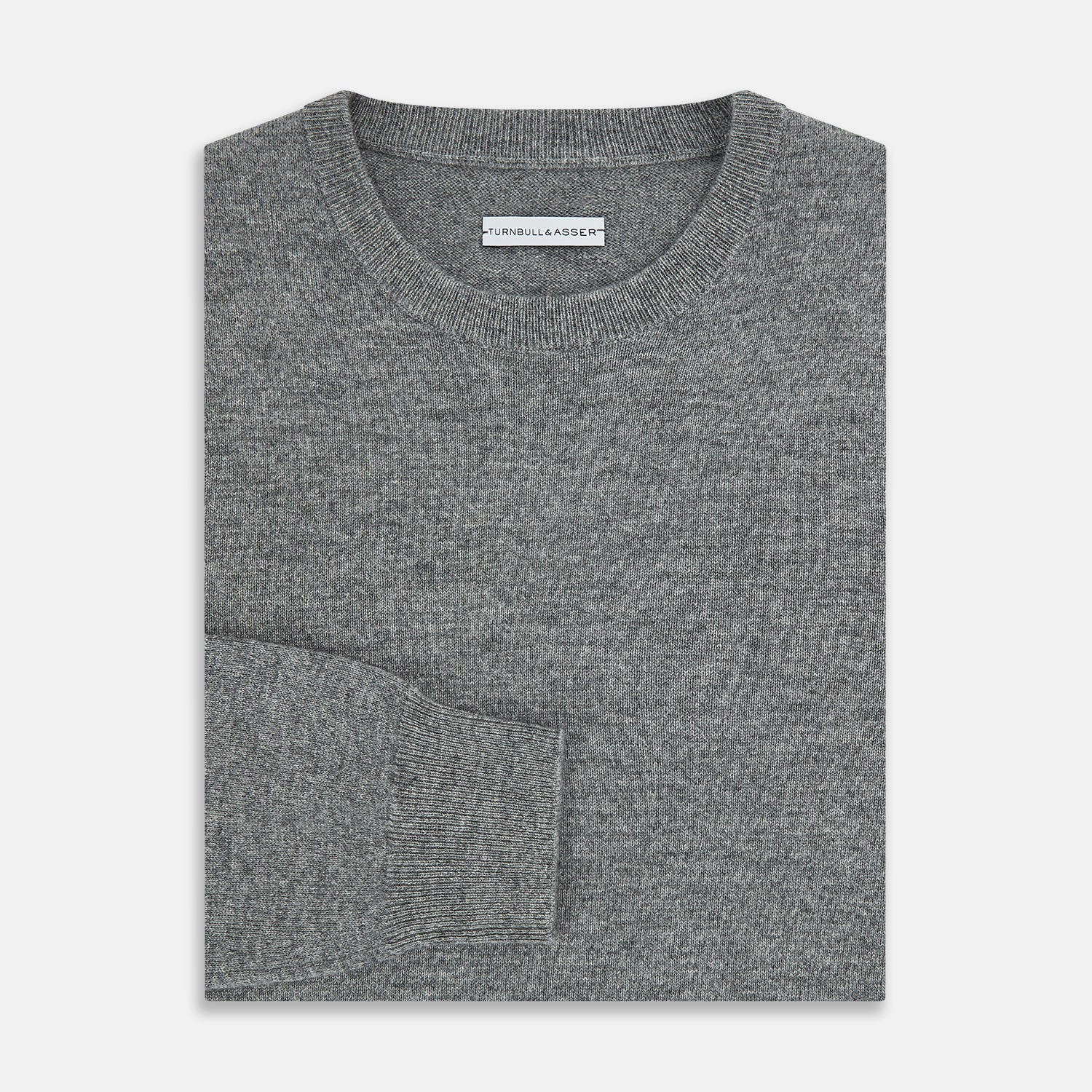 View 4 of product The Turnbull & Asser Grey Melange Cashmere Round Neck Jumper for men features a classic crewneck design with ribbed cuffs, hem, and neckline, displayed against a white background.