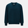 View 1 of product The Turnbull & Asser Dark Green Melange Cashmere Round Neck Jumper features long sleeves with ribbed cuffs and a ribbed hem, shown against a plain white background.
