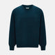The Turnbull & Asser Dark Green Melange Cashmere Round Neck Jumper features long sleeves with ribbed cuffs and a ribbed hem, shown against a plain white background.