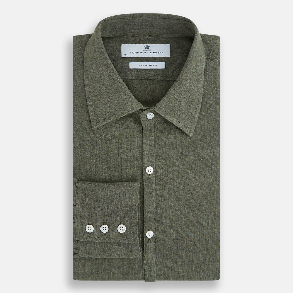 The Sage Linen Westminster Shirt by Turnbull & Asser features long sleeves, a button-up front with white buttons, a pointed Turnbull collar, and buttoned cuffs—crafted in Britain and shown here against a plain white background.