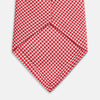 View 4 of product The HOUNDSTOOTH WHITE TULIP RED TIE by Turnbull & Asser features a refined red and white houndstooth pattern—an elegant accessory that elevates any crisp shirt or formal look.