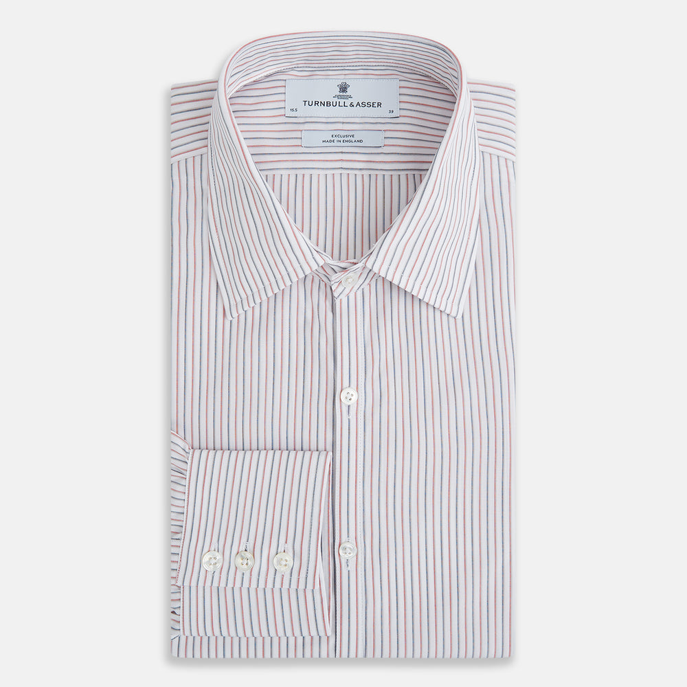 The Turnbull & Asser Red and Blue Double Stripe Westminster Shirt is a long-sleeved, button-up dress shirt with a formal collar, featuring narrow red and blue stripes on white, shown against a plain white background.
