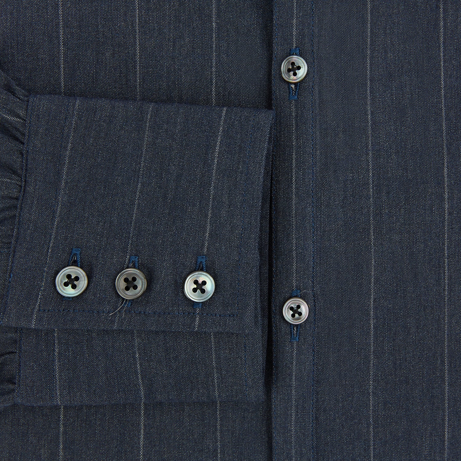 View 4 of product The Turnbull & Asser Navy Melange Wide Stripe Westminster Shirt features a classic collar, buttoned cuffs, and a tailored fit, showcasing British craftsmanship. Laid flat on a white background.