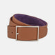 The Turnbull & Asser Lagun grained Nubuk Reversible Leather Belt features a tan finish, silver rectangular buckle, and purple inner lining, shown coiled on a white background.