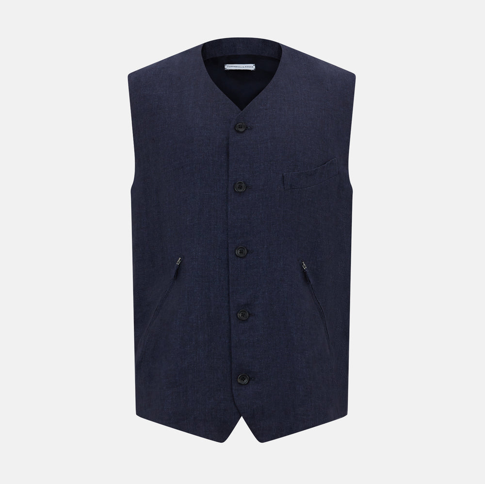 The Turnbull & Asser Navy Linen Twill Waistcoat is a sleeveless V-neck vest featuring two zippered side pockets and a chest pocket, shown on a plain white background.