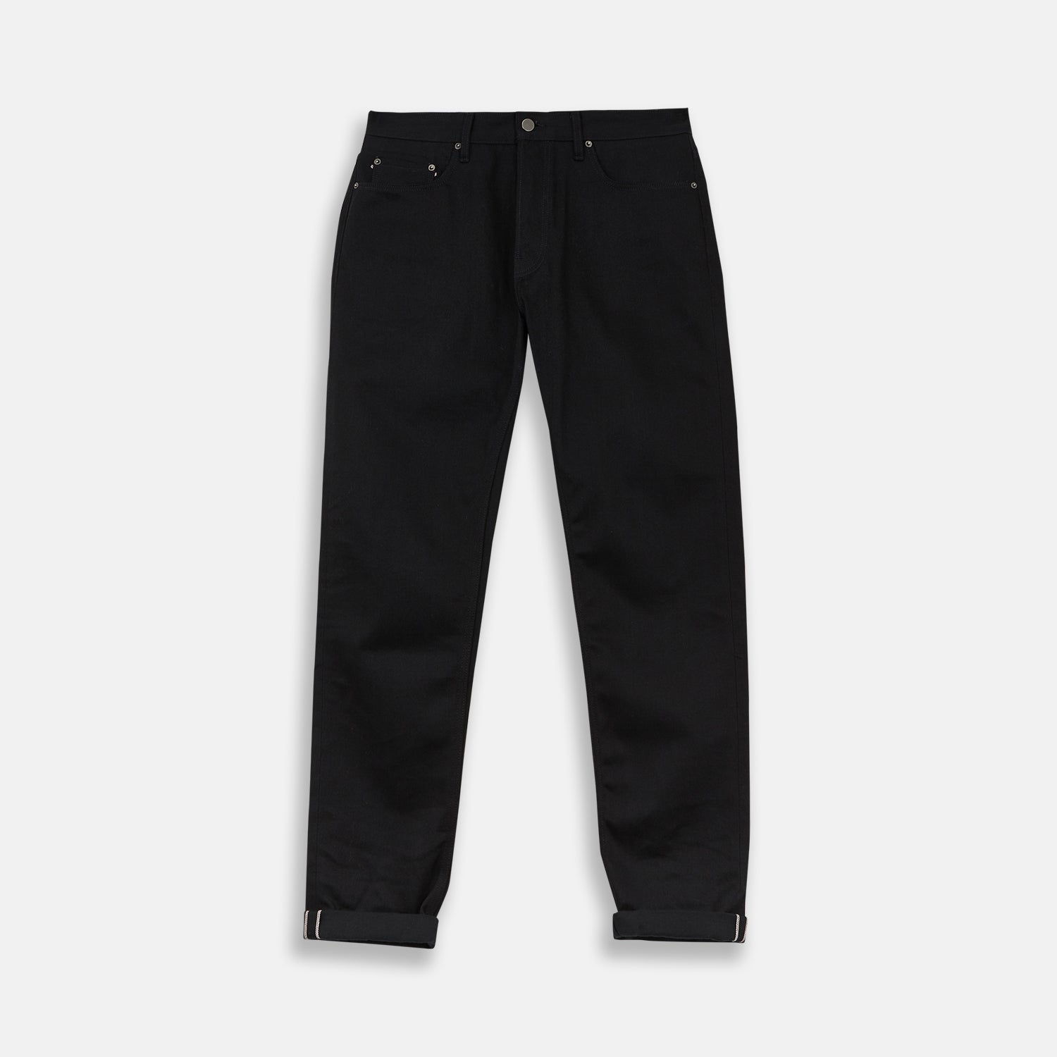 View 1 of product A pair of Turnbull & Asser Black Italian Selvedge Denim Jeans with a five-pocket design, button closure, and cuffed hems, displayed flat on a white background.